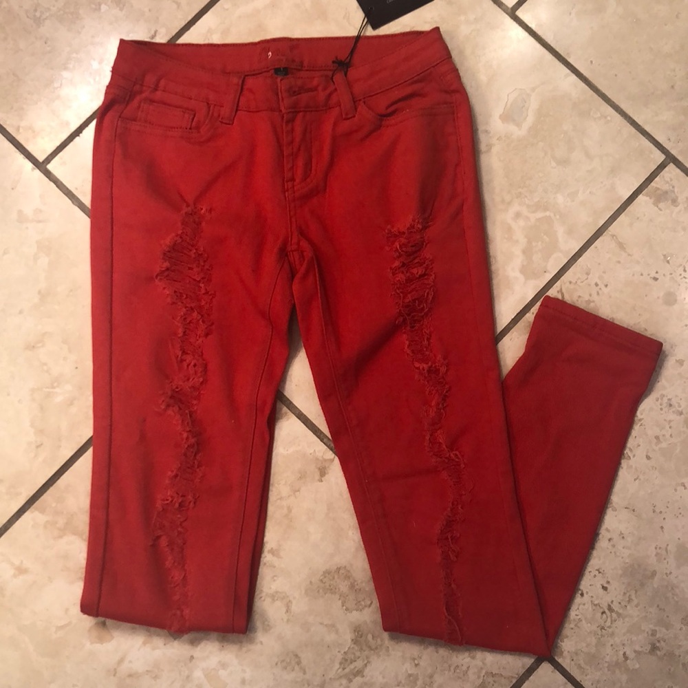 red denim ripped jeans